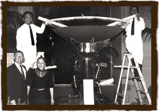 People standing in front of a giant martini glass